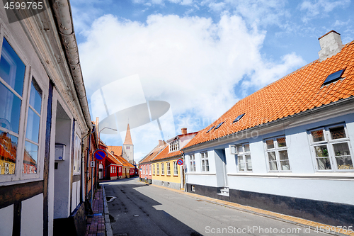 Image of Danish village in the summer with red rooftops