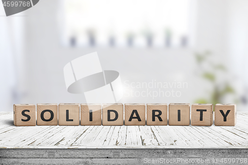 Image of Solidarity message on a wooden table