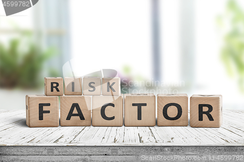 Image of Risk factor sign on a wooden table