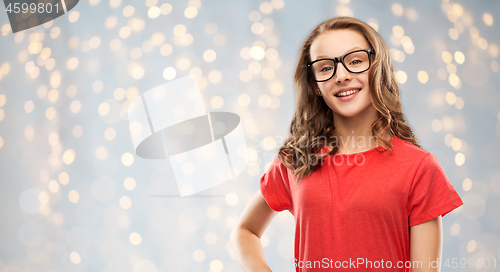 Image of smiling student girl in glasses and red t-shirt