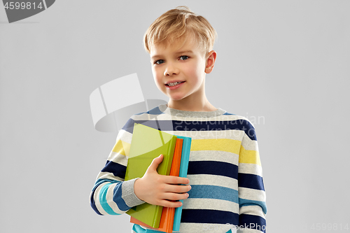 Image of little student boy with books