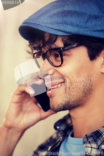 Image of close up of hipster man calling on smartphone