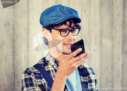 Image of man recording voice or calling on smartphone