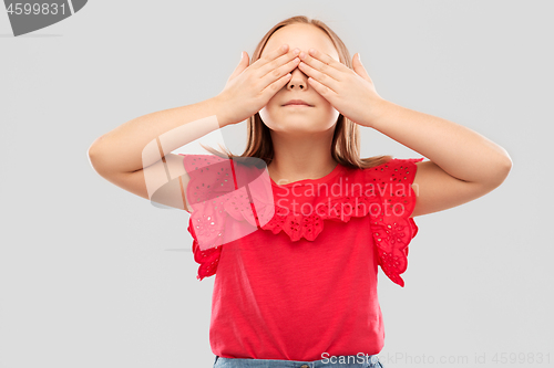 Image of girl with eyes closed by hands