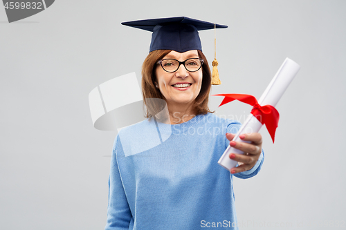 Image of happy senior graduate student woman with diploma