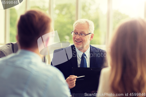 Image of business people with laptop meeting in office