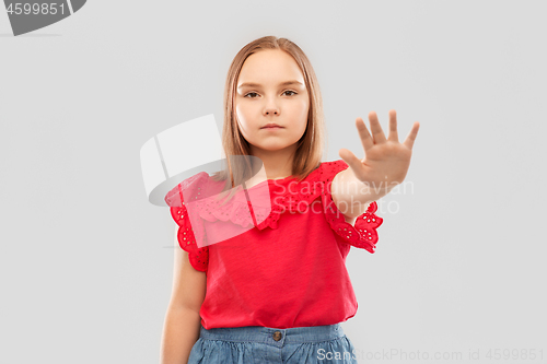 Image of beautiful girl showing stop gesture