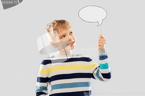 Image of smiling boy holding blank speech bubble