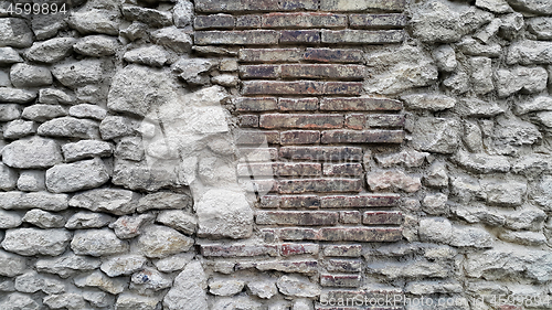 Image of Ancient wall with bricks and cobblestones