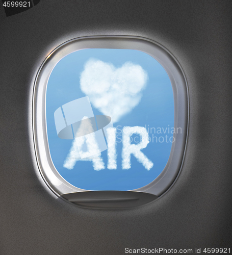 Image of Airplaine window with heart symbol and word air from clouds.