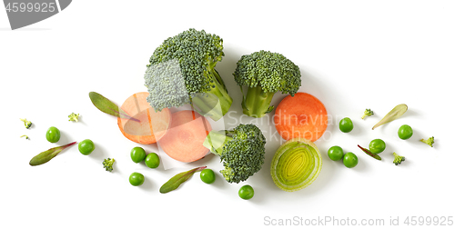 Image of fresh broccoli, carrot and green peas isolated on white backgrou