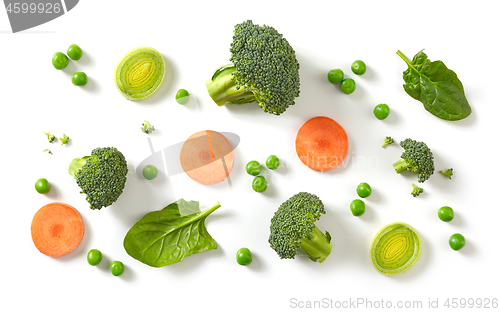 Image of fresh broccoli, carrot and green peas isolated on white backgrou