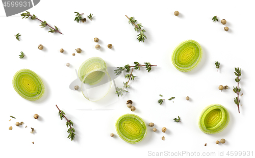 Image of leak slices and spices on white background