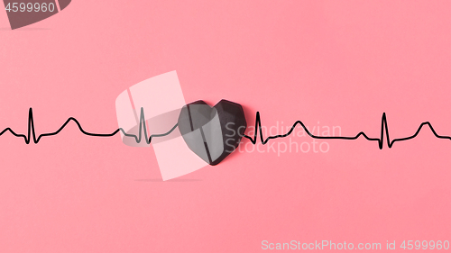 Image of Echocardiogram of love, cardiac markers with plastic black heart.