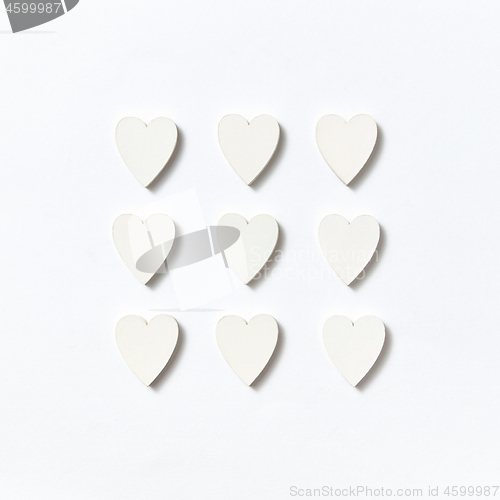 Image of Valentine\'s square pattern from paper hearts. Flat lay.