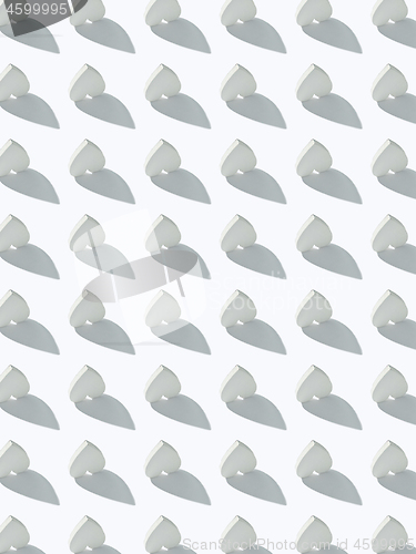 Image of Celebratory pattern from paper hearts with hard shadows.