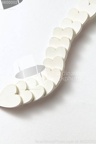 Image of Creative chain from plaster Valentine\'s heartw with soft shadows.