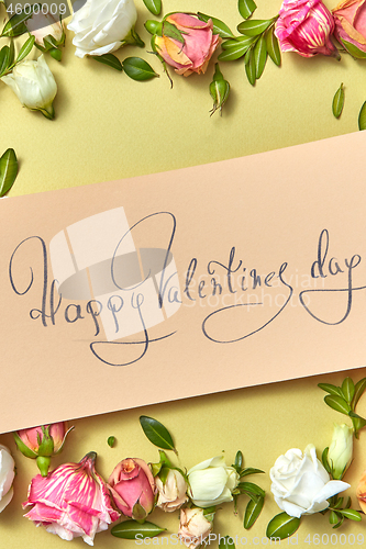 Image of Greeting Valentine\'s card with natural flowers frame.