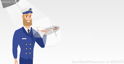 Image of Cheerful airline pilot with the model of airplane.