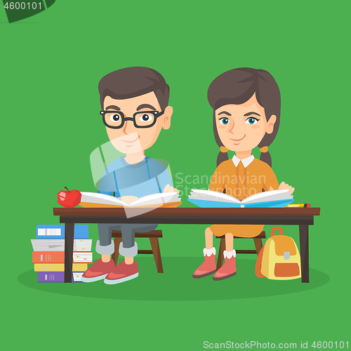 Image of Boy and girl sitting at the table and reading.