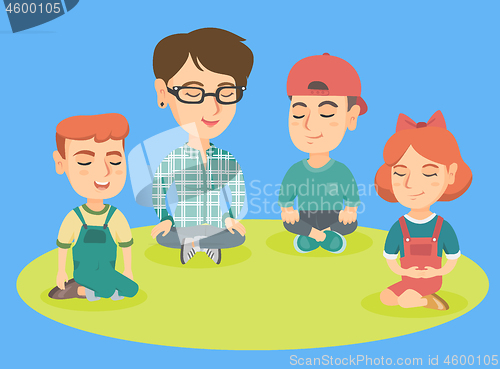 Image of Kindergarten teacher and children meditating.