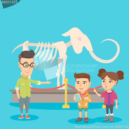 Image of Kids with a teacher studying a skeleton in museum.