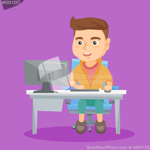 Image of Caucasian schoolboy working on a computer at home.