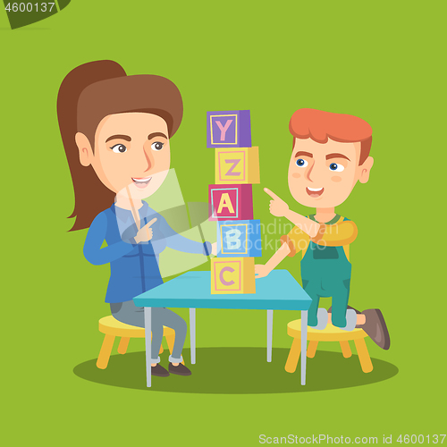 Image of Mother playing with a son with educational cubes.