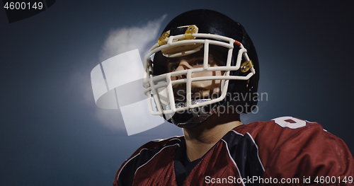 Image of portrait of young confident American football player