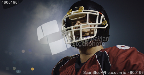 Image of portrait of young confident American football player