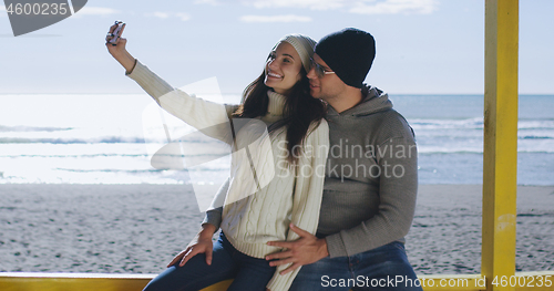 Image of Gorgeous couple taking picture of herselfe