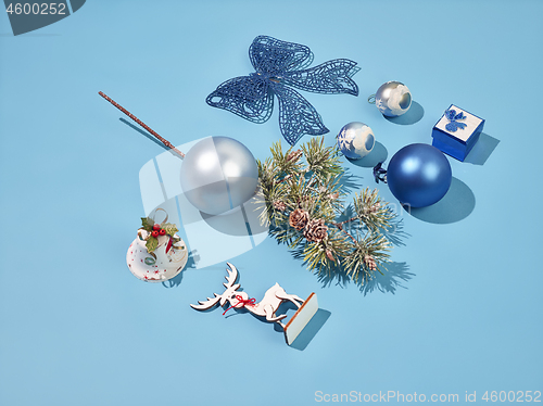 Image of Christmas decoration background over blue background, above view with copy space