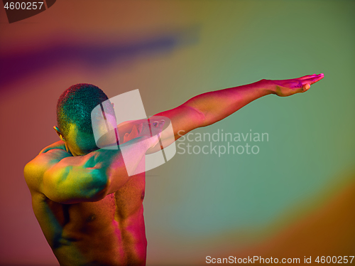 Image of Close up portrait of a young naked african man looking at camera indoors