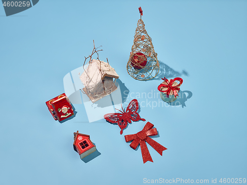 Image of Christmas decoration background over blue background, above view with copy space