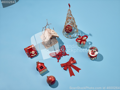 Image of Christmas decoration background over blue background, above view with copy space