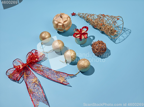 Image of Christmas decoration background over blue background, above view with copy space