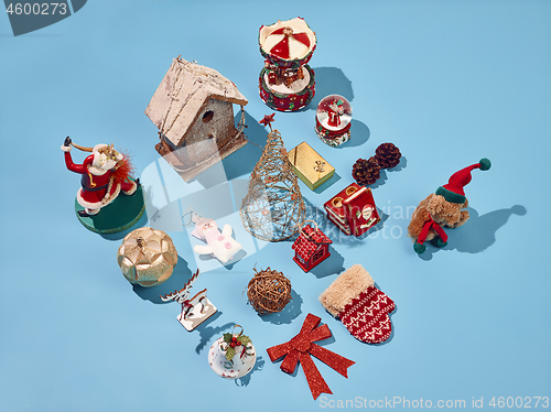 Image of Christmas decoration background over blue background, above view with copy space