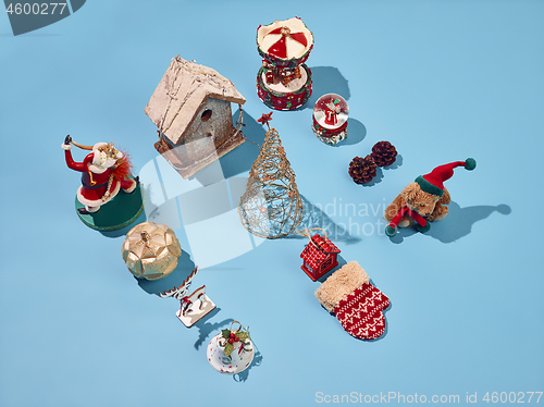 Image of Christmas decoration background over blue background, above view with copy space