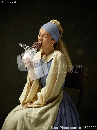 Image of Medieval Woman in Historical Costume Wearing Corset Dress and Bonnet.