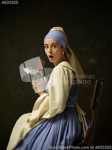 Image of Medieval Woman in Historical Costume Wearing Corset Dress and Bonnet.