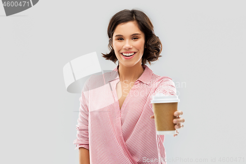 Image of woman drinking takeaway coffee in paper cup
