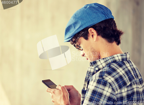 Image of close up of man texting message on smartphone