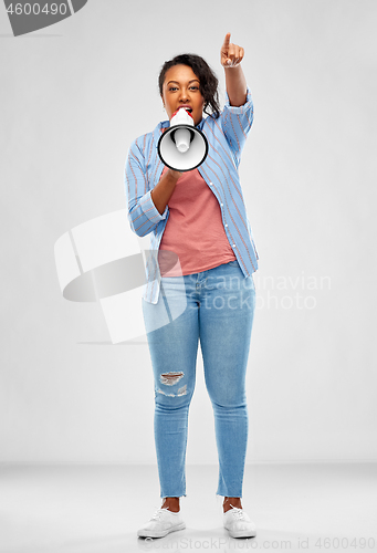 Image of happy african american woman over grey background