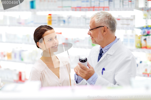 Image of apothecary and woman with drug at pharmacy