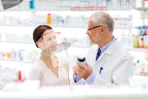 Image of apothecary and woman with drug at pharmacy