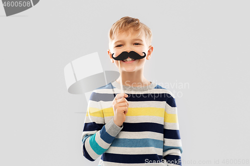 Image of smiling boy with black vintage moustaches