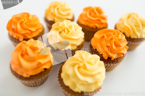 Image of cupcakes with frosting on white background