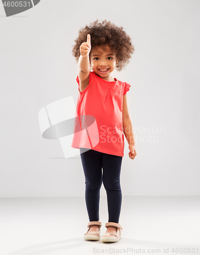 Image of little african american girl showing thumbs up