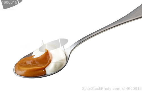 Image of spoon of yogurt and soft caramel