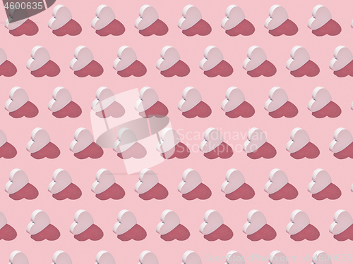 Image of Valentine\'s pattern from vertical hearts with hard shadows.